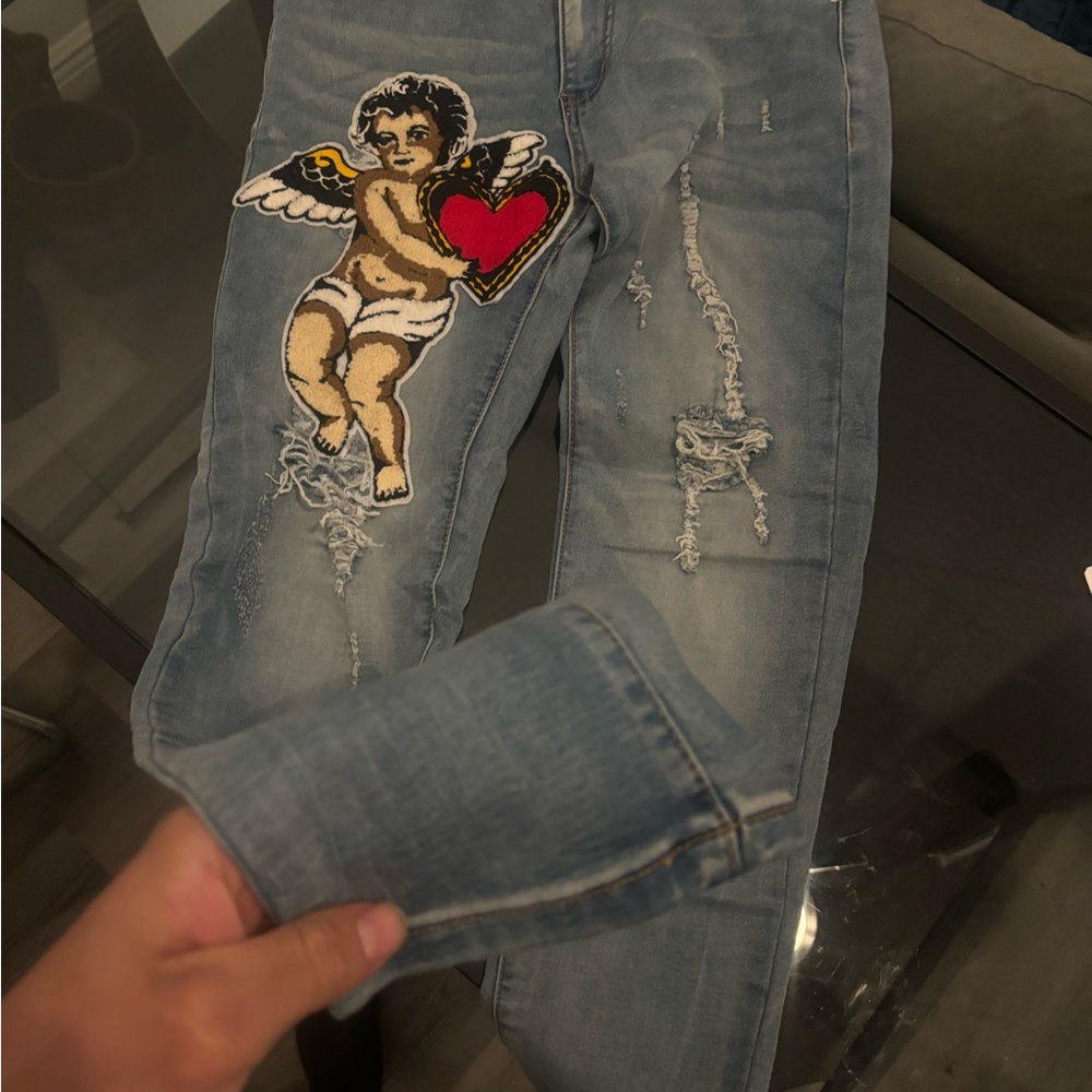 Blue Relaxed Jeans with Red Patch and Distressed Details